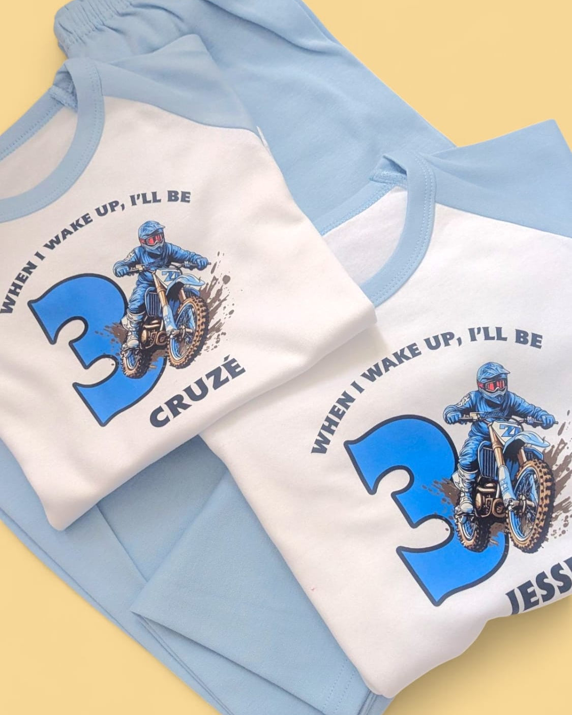 Children's clothing set with MOTOCROSS BIRTHDAY personaliSed designs on a yellow background